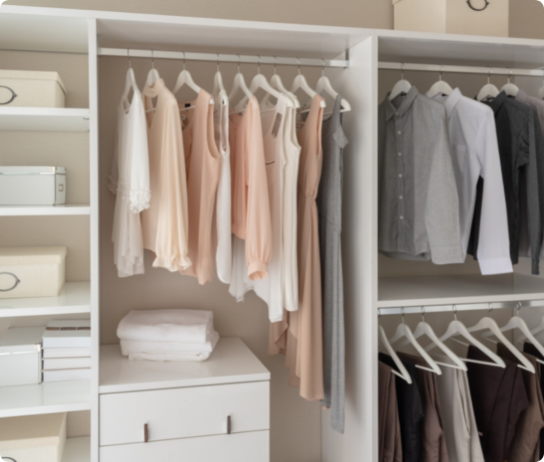 An organized closet with male and female garments